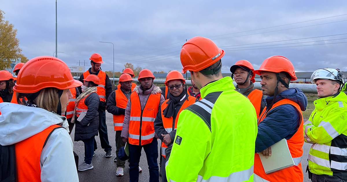Participants with safety helmets during study visit at Karlstad Energi.